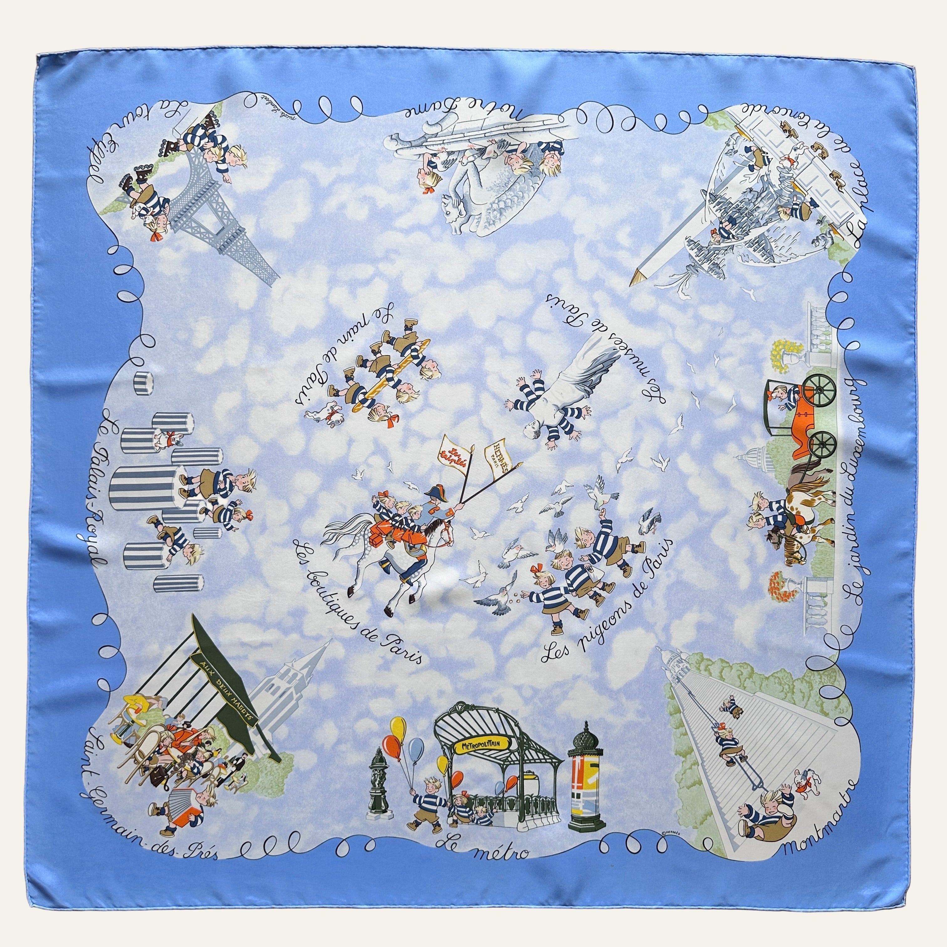 Foulard Hermès Les Triplés (Les Pigeons de Paris) par Nicole Lambert, soie bleu ciel vue d'ensemble.
