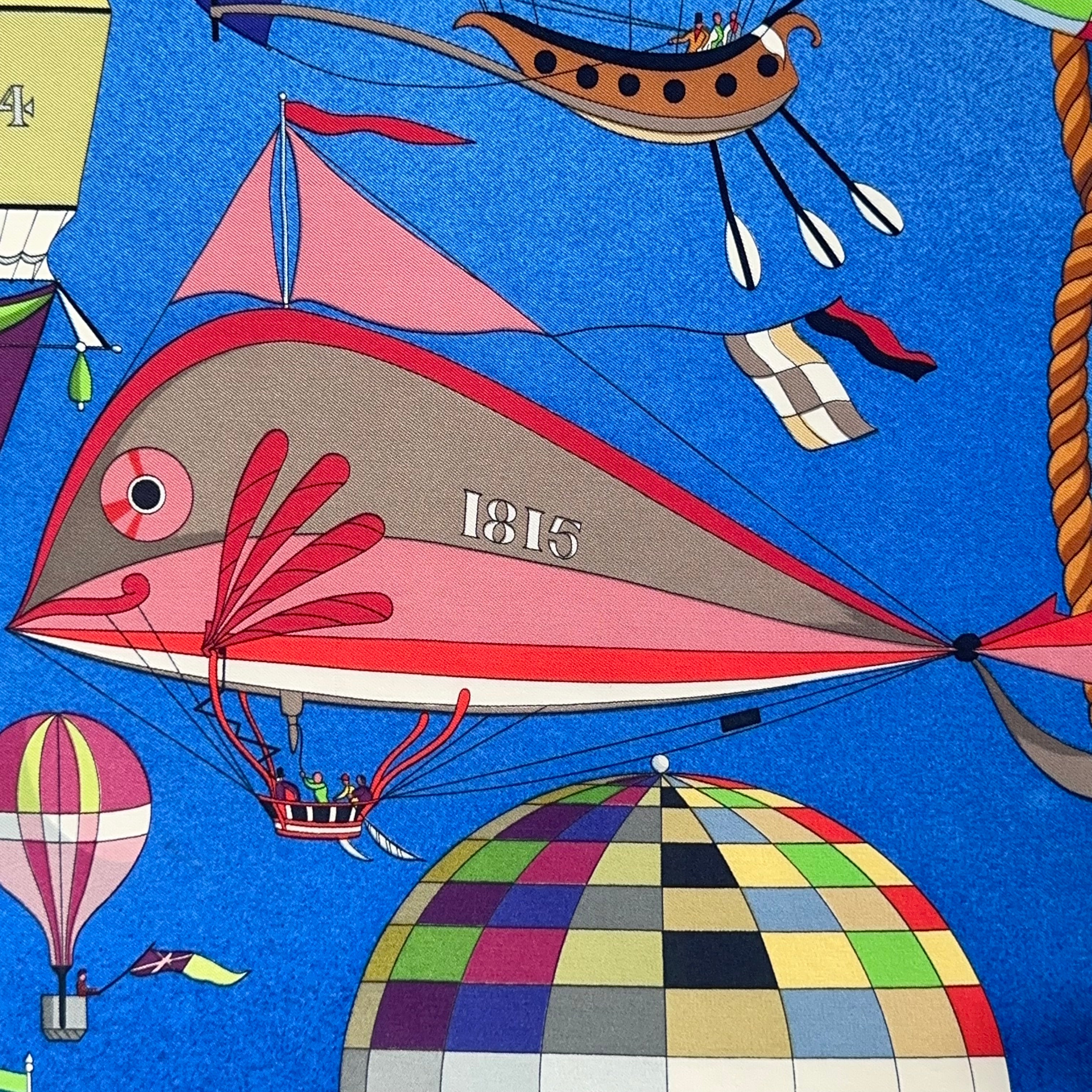 Illustration d'un dirigeable rose en forme de poisson ou baleine daté "1815" flottant dans le ciel bleu du carré Hermès.